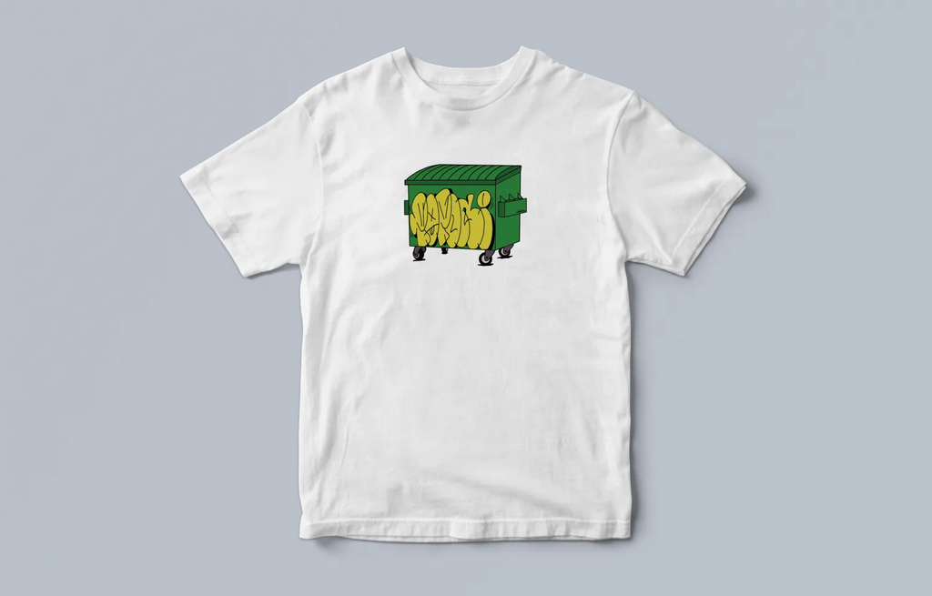 Brkasa Tee — white crewneck with a green dumpster graphic tagged in yellow graffiti across the chest