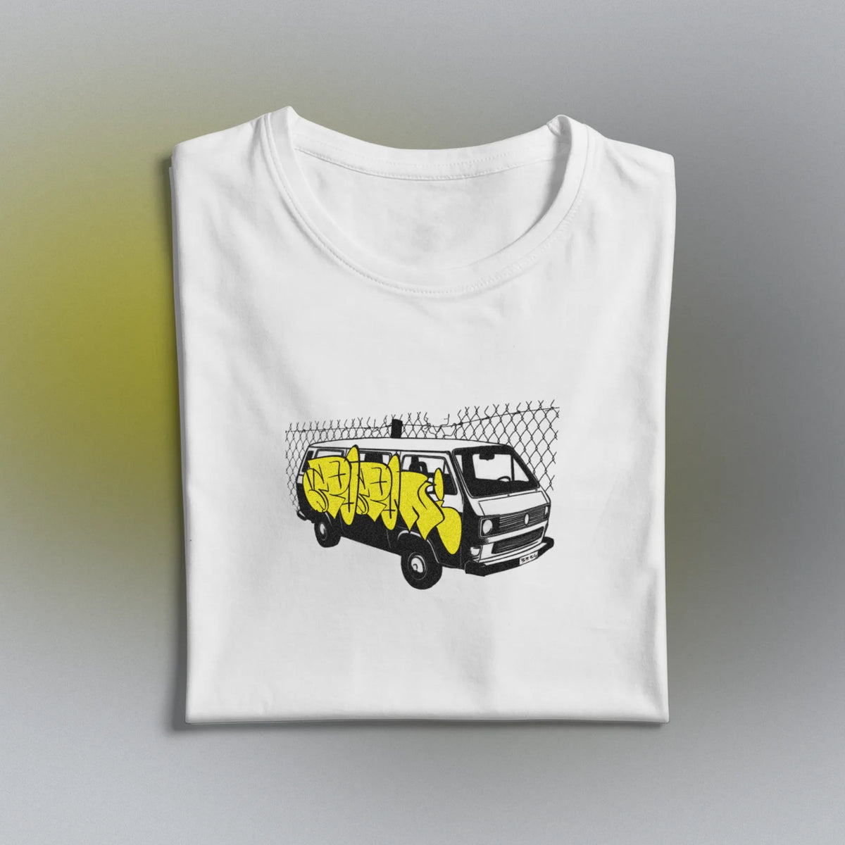 Yellow Van Tee folded, the van print across the chest